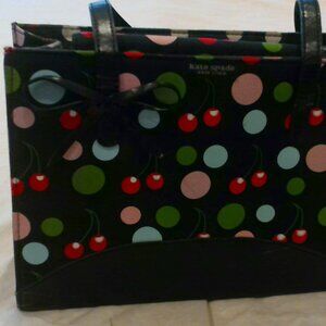 Kate Spade Purse.  Box frame style.  Black with Cherry and Dot print.